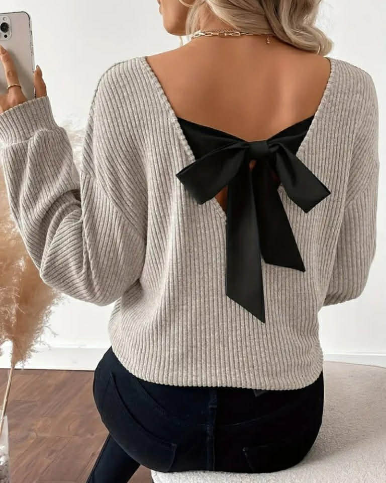 Elegant White Top With A Bow On The Back